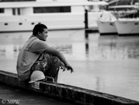 worker takes a minute to contemplate, wish, remember, dream, Auckland viaduct harbour